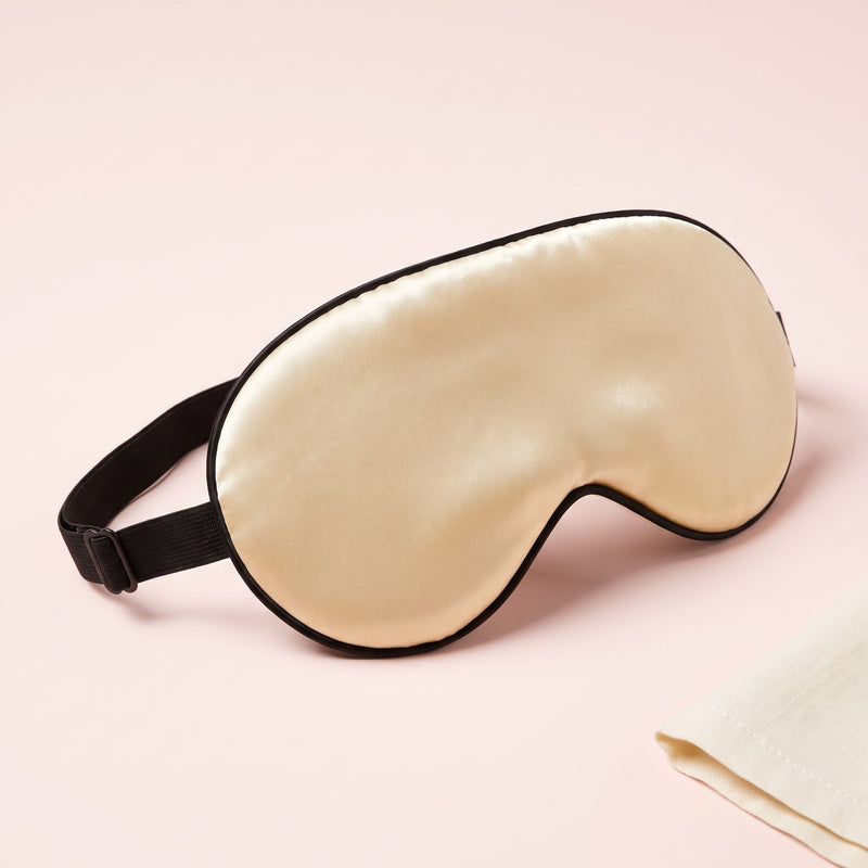 Snugglet Silky Mask in Golden, contoured satin-look sleep eye mask on a slim elastic strap