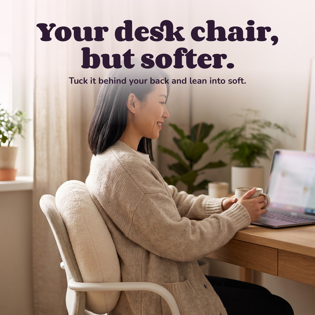 Woman using the Snugglet Donut Buddy – Your desk chair, but softer.