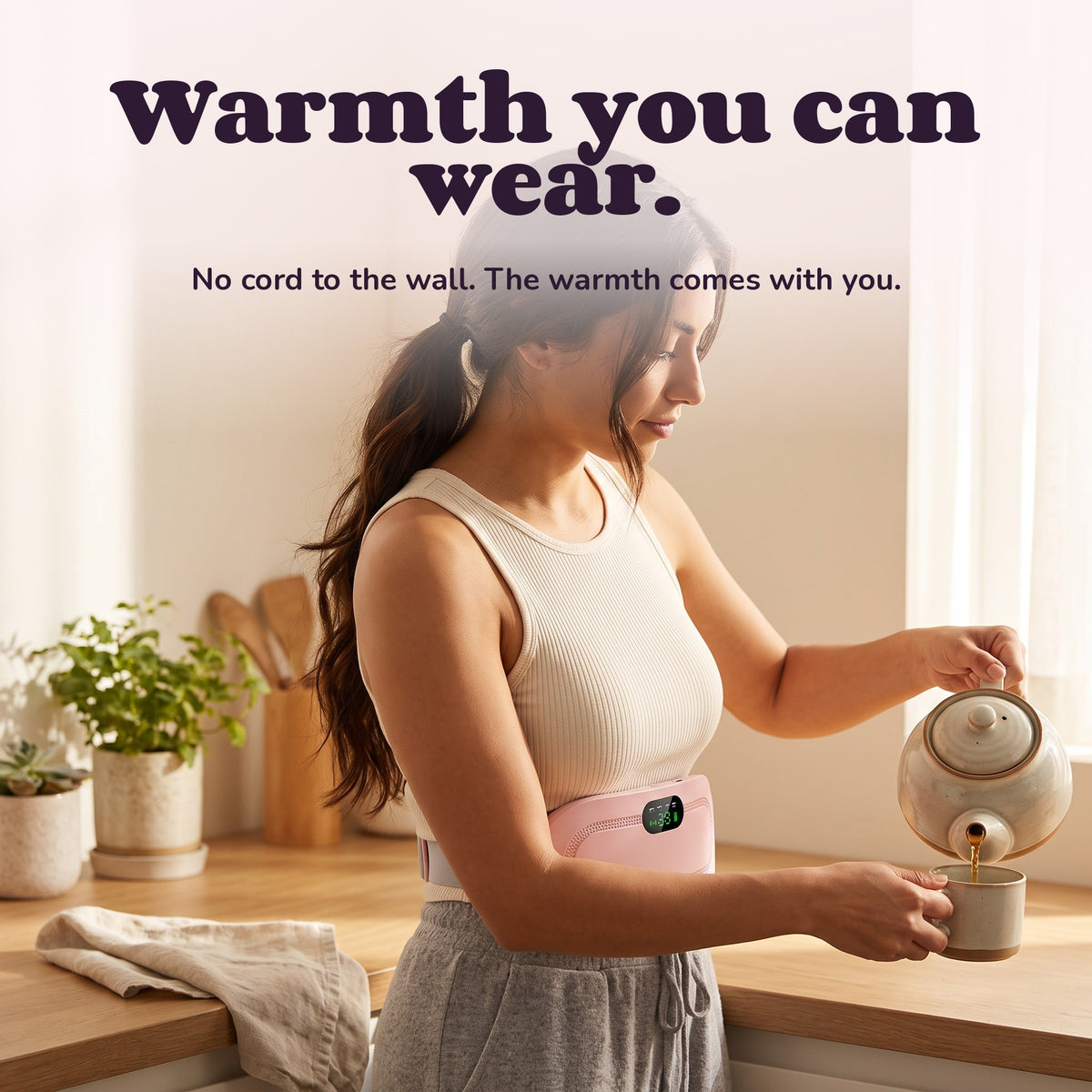 Woman using the Snugglet Moon Belt – Warmth you can wear.