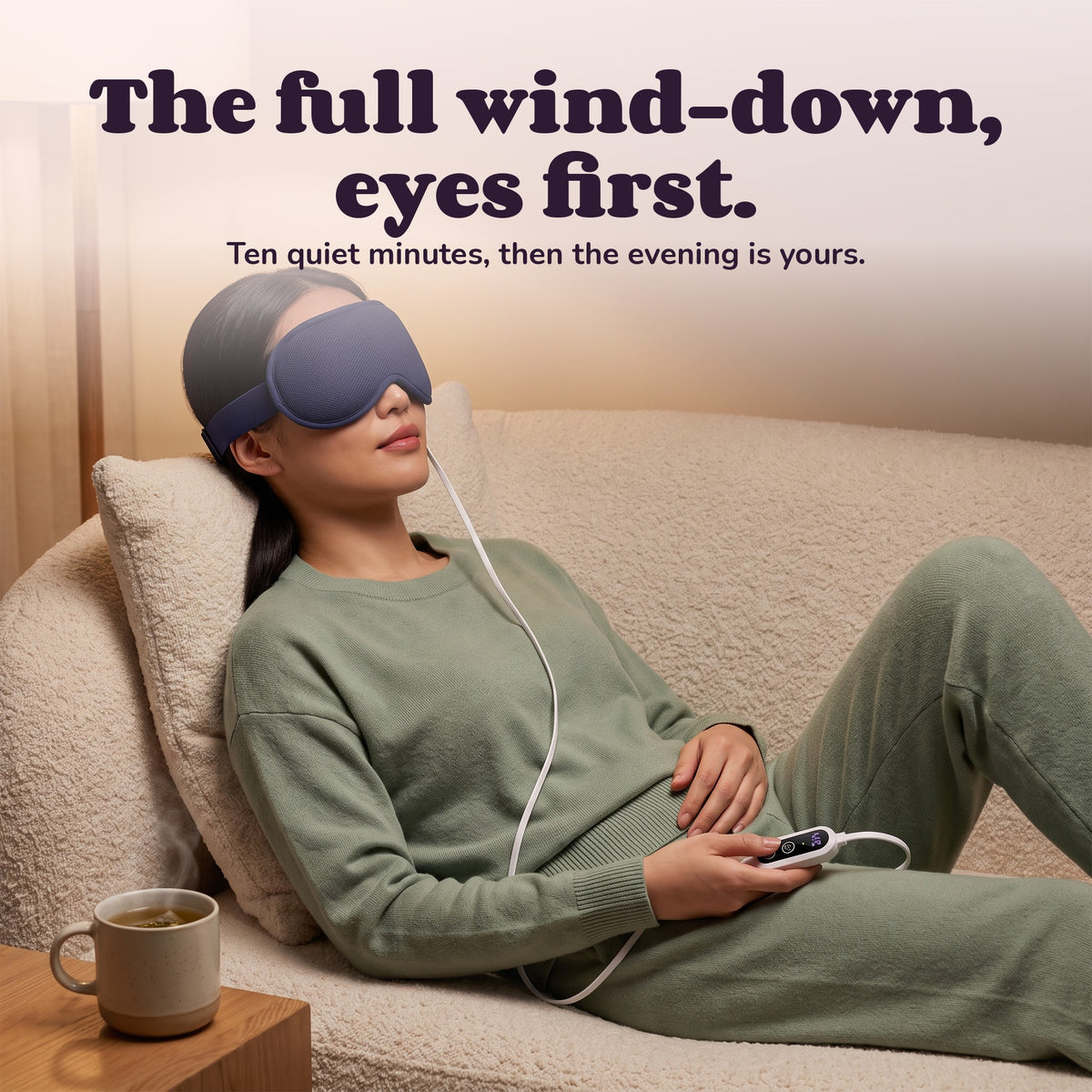 Woman using the Snugglet Dusk Mask Pro – The full wind-down, eyes first.