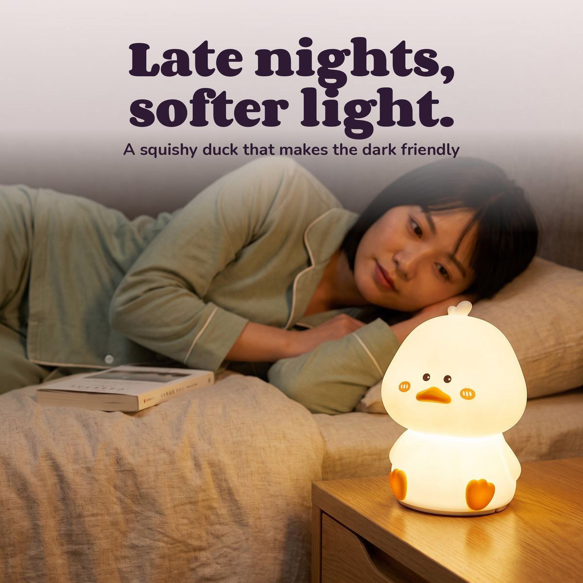 Woman using the Snugglet Duck Glow – Late nights, softer light.