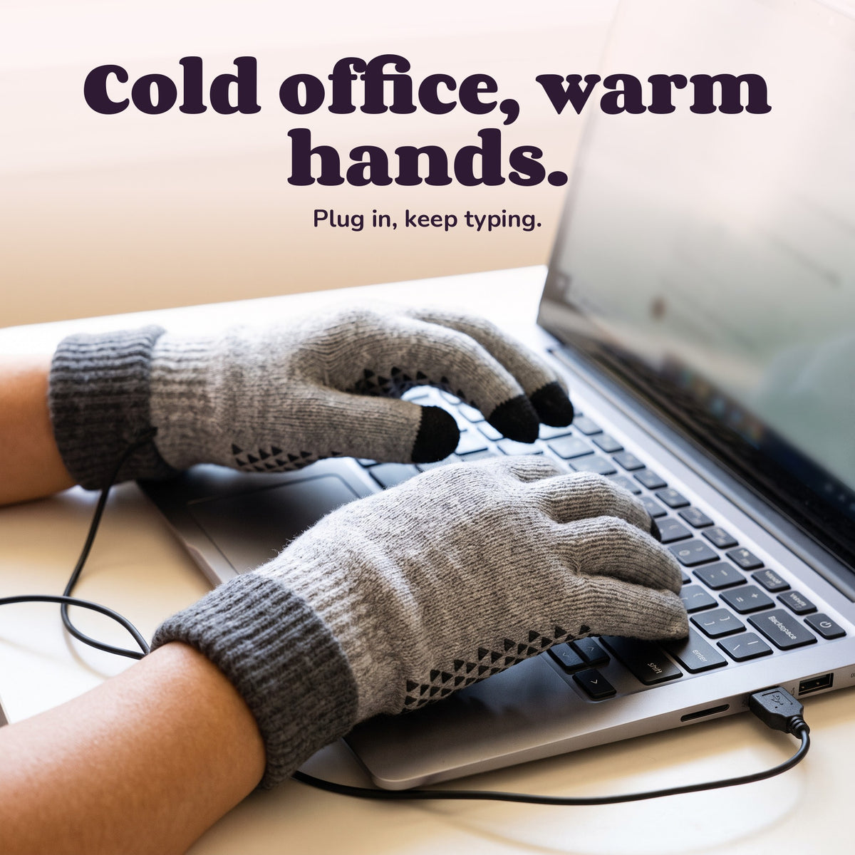 Woman using the Snugglet Warm Keys – Cold office, warm hands.