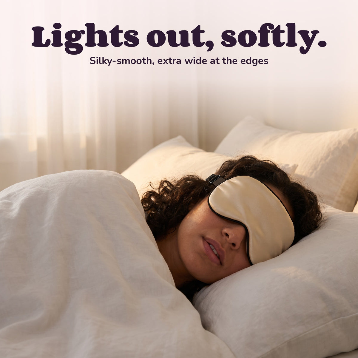 Woman using the Snugglet Silky Mask – Lights out, softly.