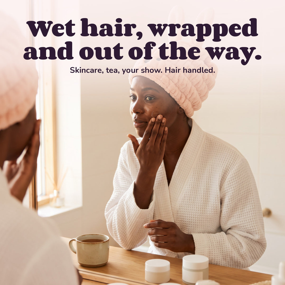 Woman using the Snugglet Hair Hug – Wet hair, wrapped and out of the way.
