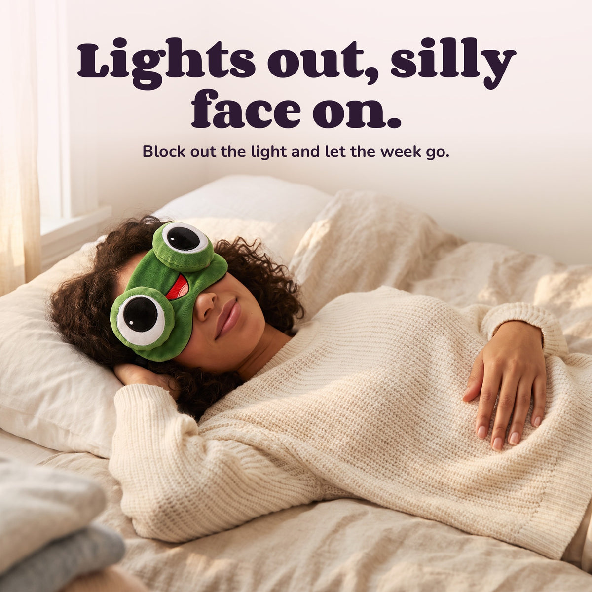 Woman using the Snugglet Silly Faces – Lights out, silly face on.