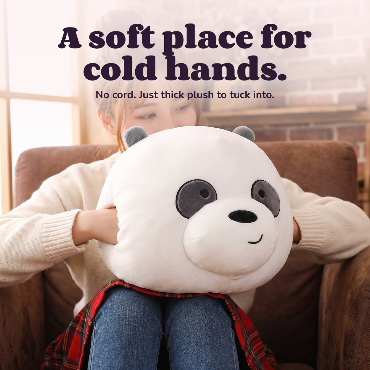 Woman using the Snugglet Panda Buddy – A soft place for cold hands.