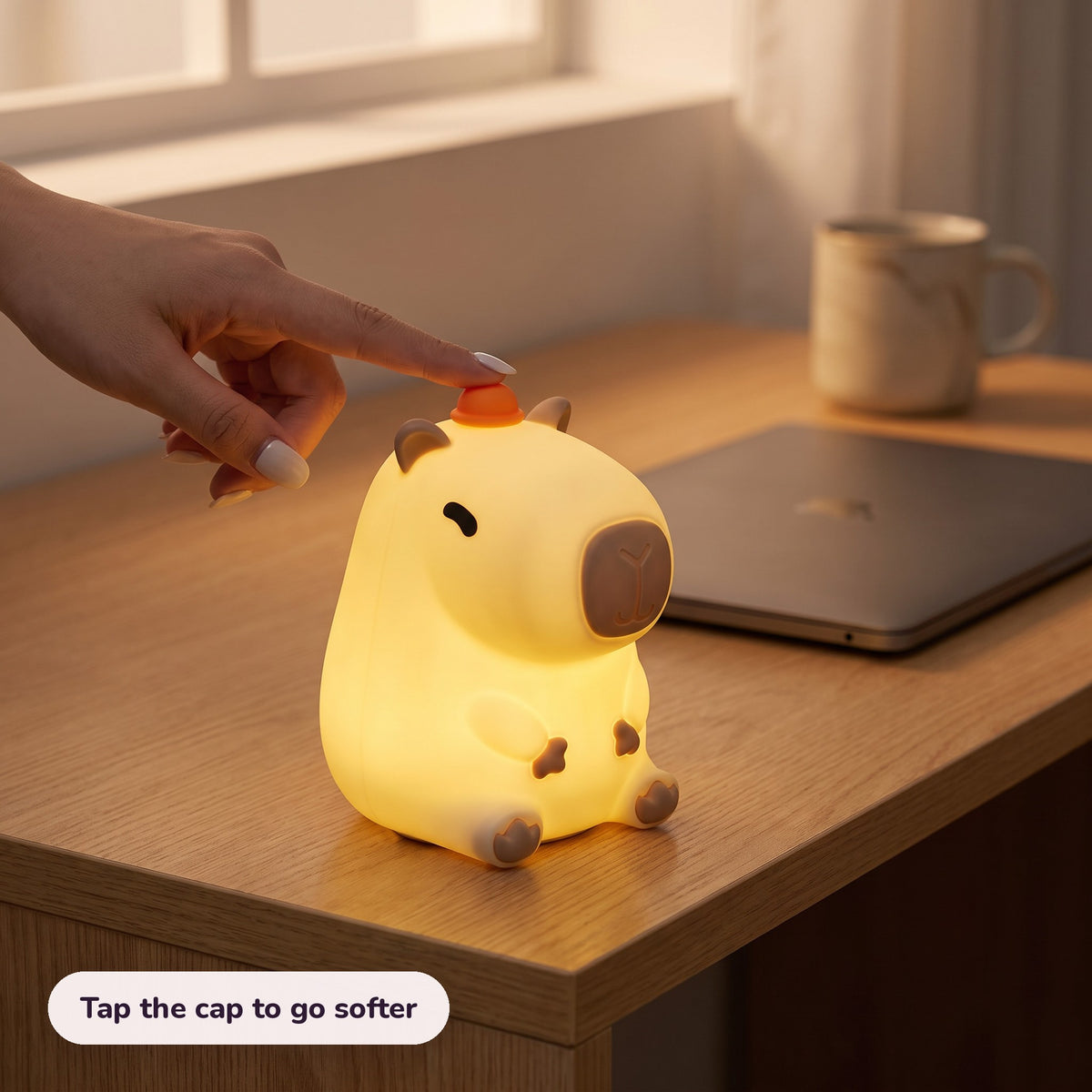 Snugglet Capy Glow in use – Tap the cap to go softer