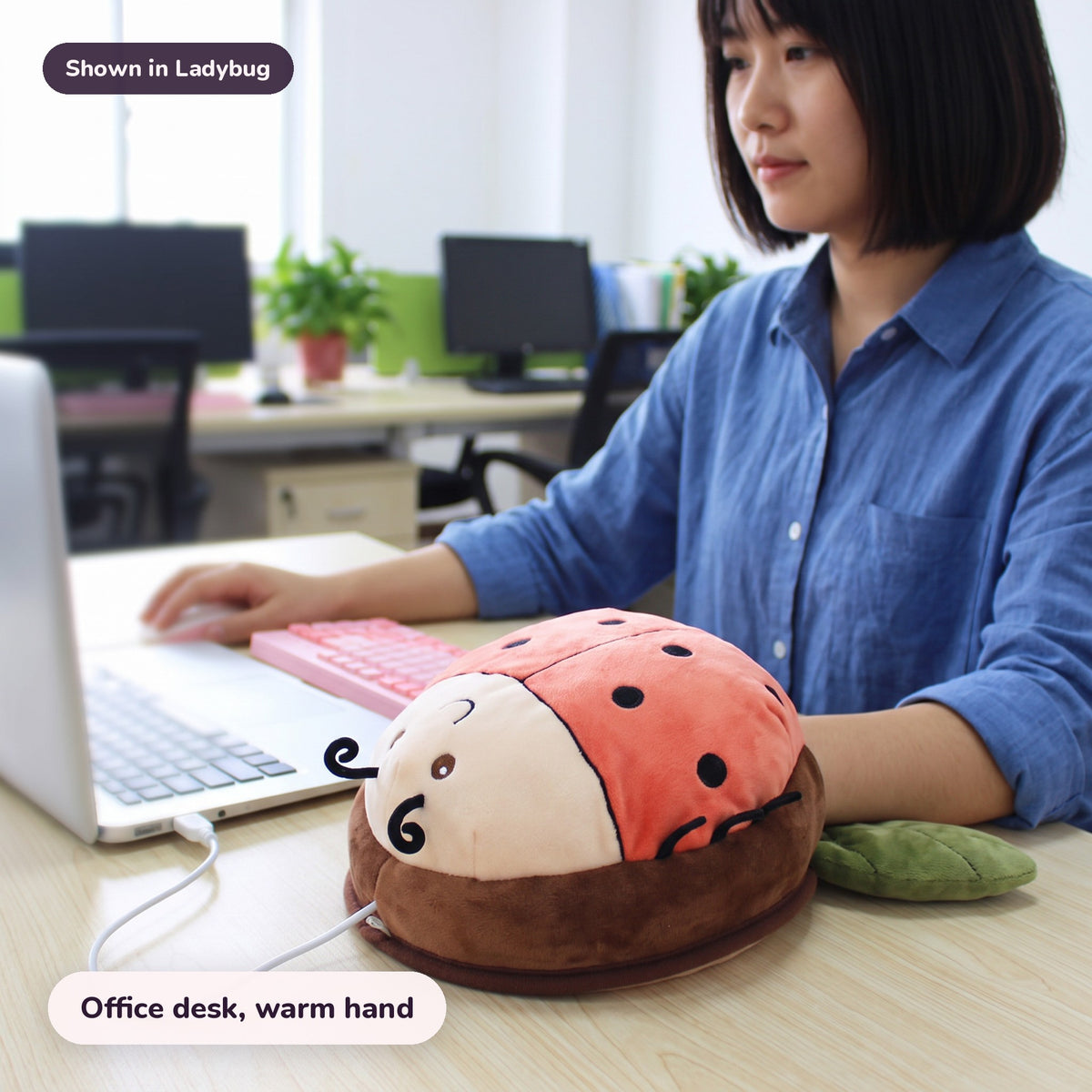 Snugglet Bug Muff in Ladybug: Office desk, warm hand