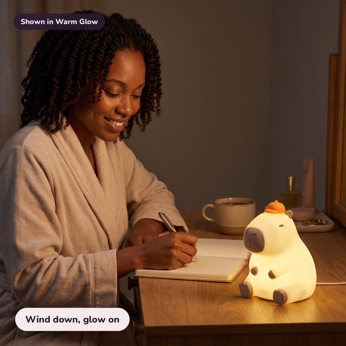 Woman using the Snugglet Capy Glow in Warm Glow – Wind down, glow on