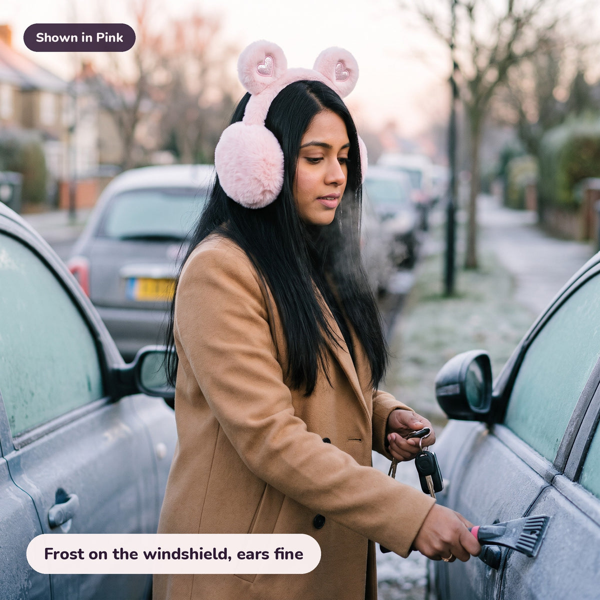 Woman using the Snugglet Bear Muffs in Pink – Frost on the windshield, ears fine