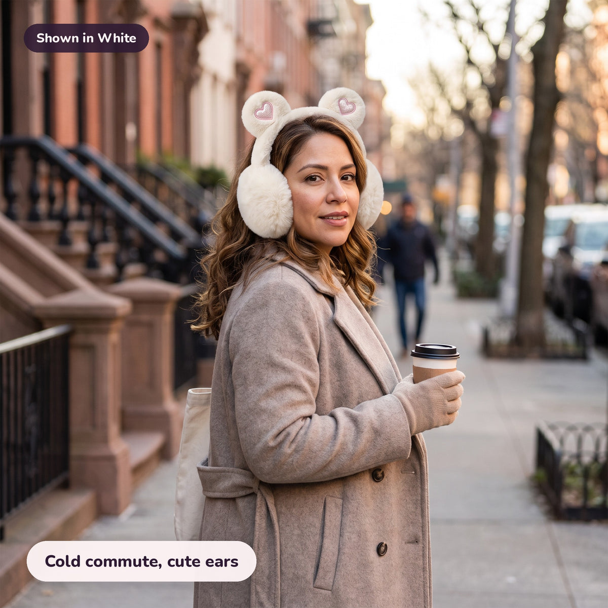 Woman using the Snugglet Bear Muffs in White – Cold commute, cute ears