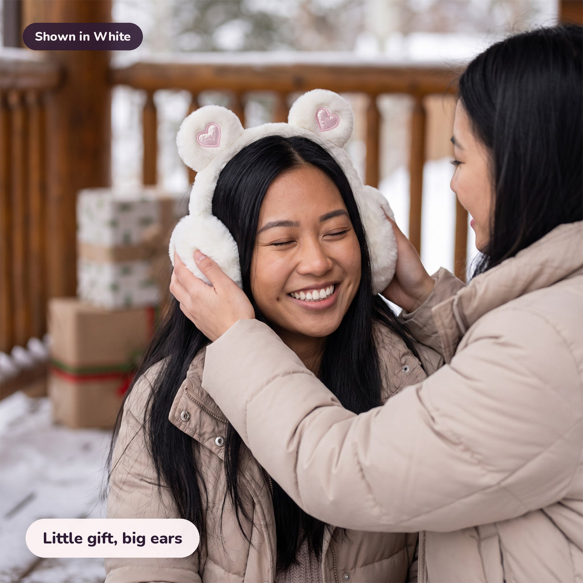 Woman using the Snugglet Bear Muffs in White – Little gift, big ears