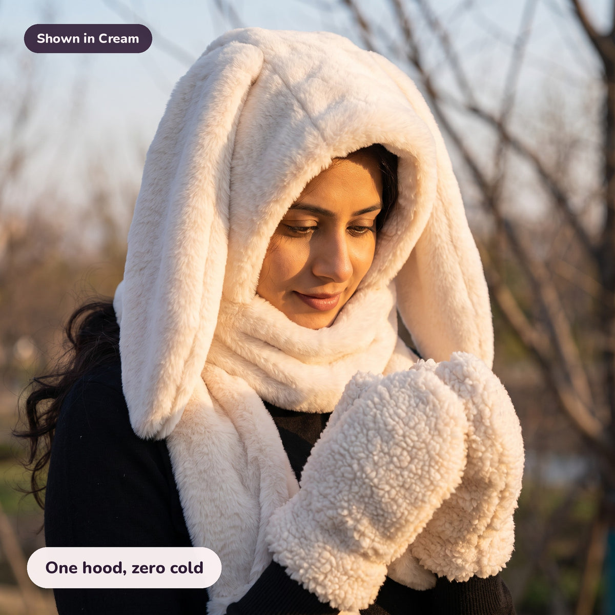 Woman using the Snugglet Bunny Set in Cream – One hood, zero cold