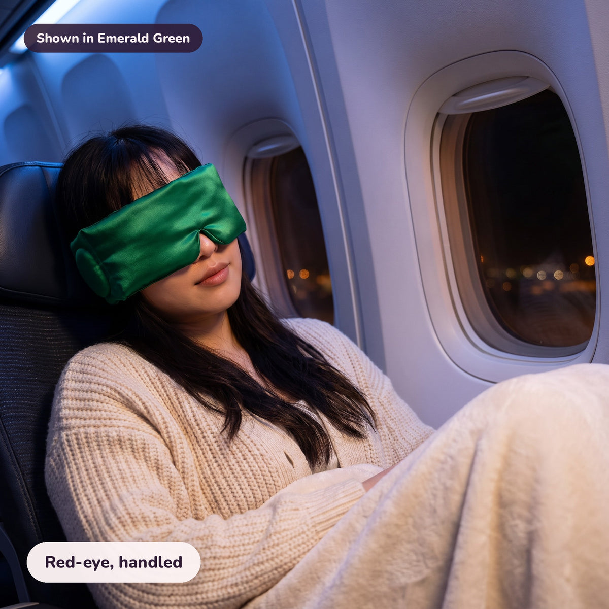 Snugglet Hush Mask in Emerald Green: Red-eye, handled