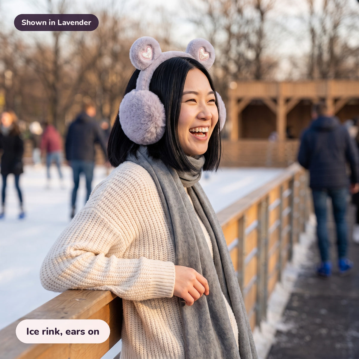 Woman using the Snugglet Bear Muffs in Lavender – Ice rink, ears on