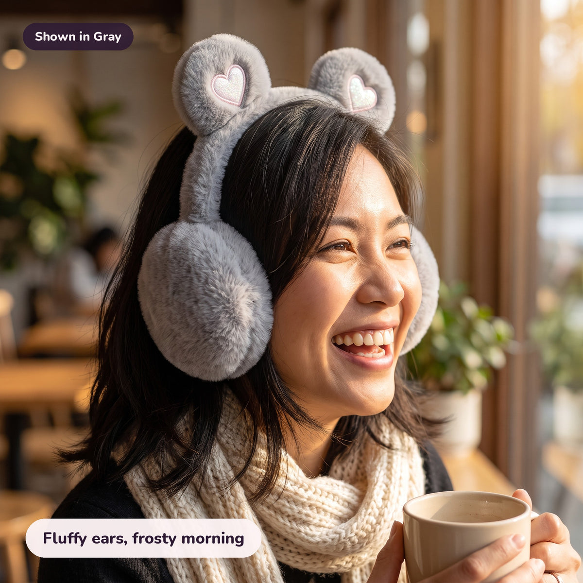 Woman using the Snugglet Bear Muffs in Gray – Fluffy ears, frosty morning