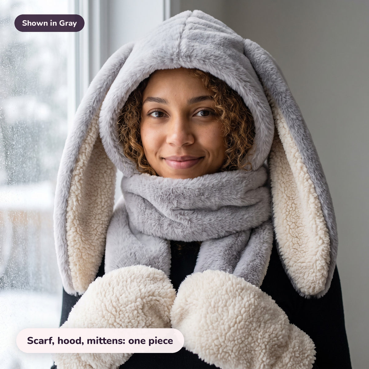 Woman using the Snugglet Bunny Set in Gray – Scarf, hood, mittens: one piece