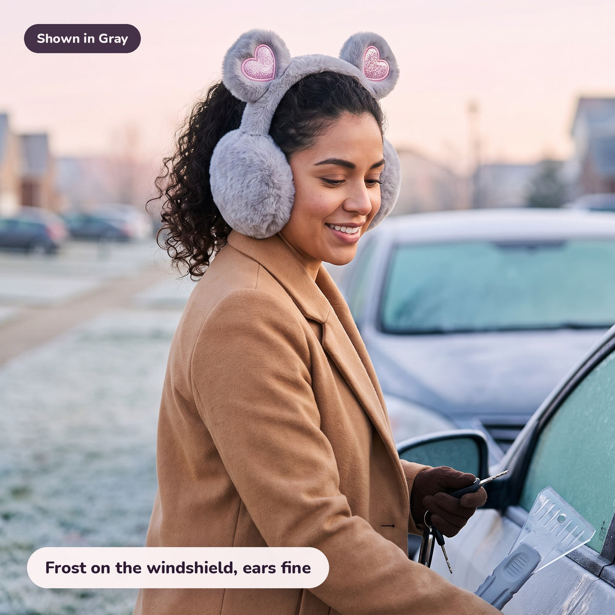 Woman using the Snugglet Bear Muffs in Gray – Frost on the windshield, ears fine